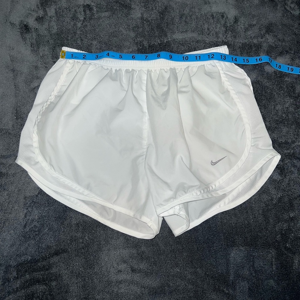 NIKE-  white running shorts.